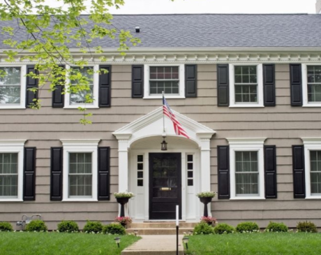 Tan Siding with Black Shutters