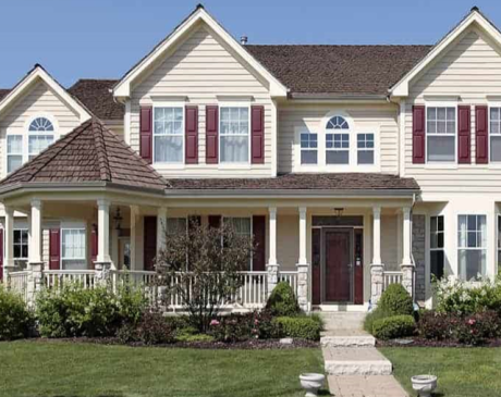 Tan Siding with Burgundy Shutters