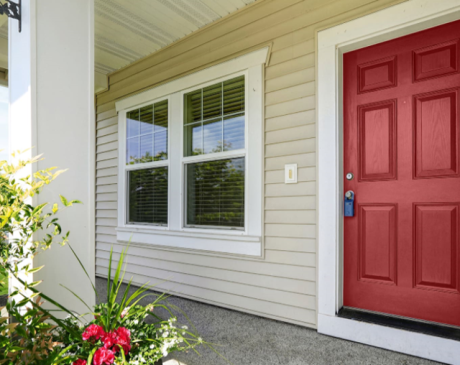 Tan Siding with Crimson Front Door