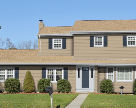 Tan Siding with Grey Shutters