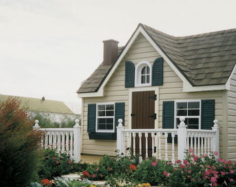 Tan Siding with Natural Green Shutters