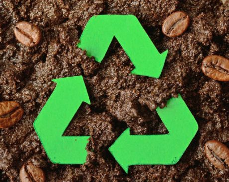 Recycling symbol on coffee grounds - Concept of ecology and recycling