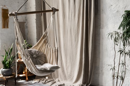 Comfortable,Textile,Hanging,Swing,With,Cushions,In,White,Room,At