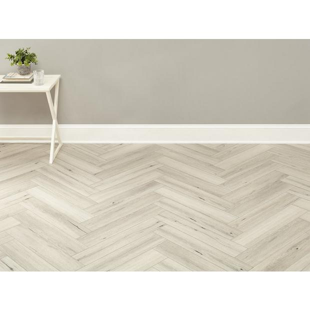White Baseboard with Herringbone Wood Floor